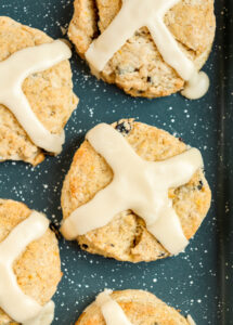 spiced currant scones with cross-shaped icing on top