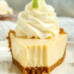slice of key lime pie with whipped cream on top