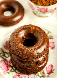 stack of glazed chocolate cake doughnuts