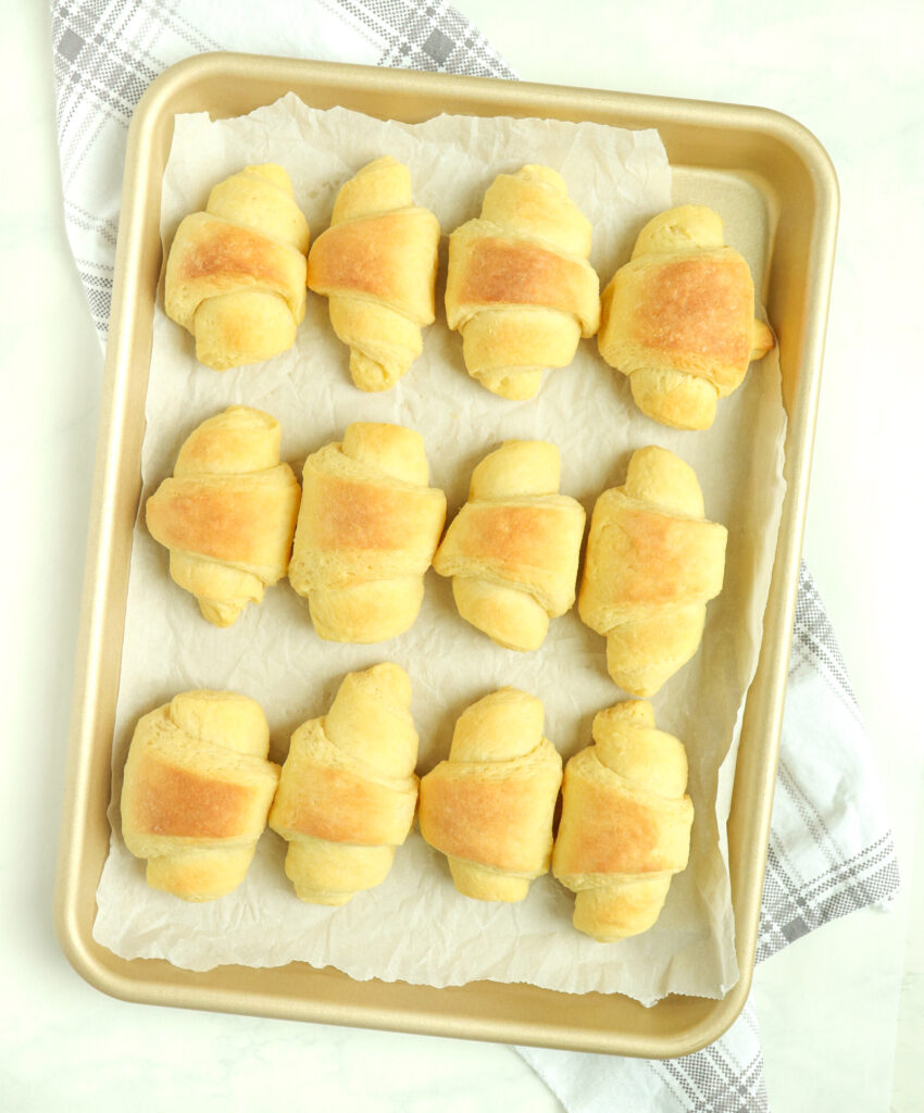 bread rolls on a baking pan