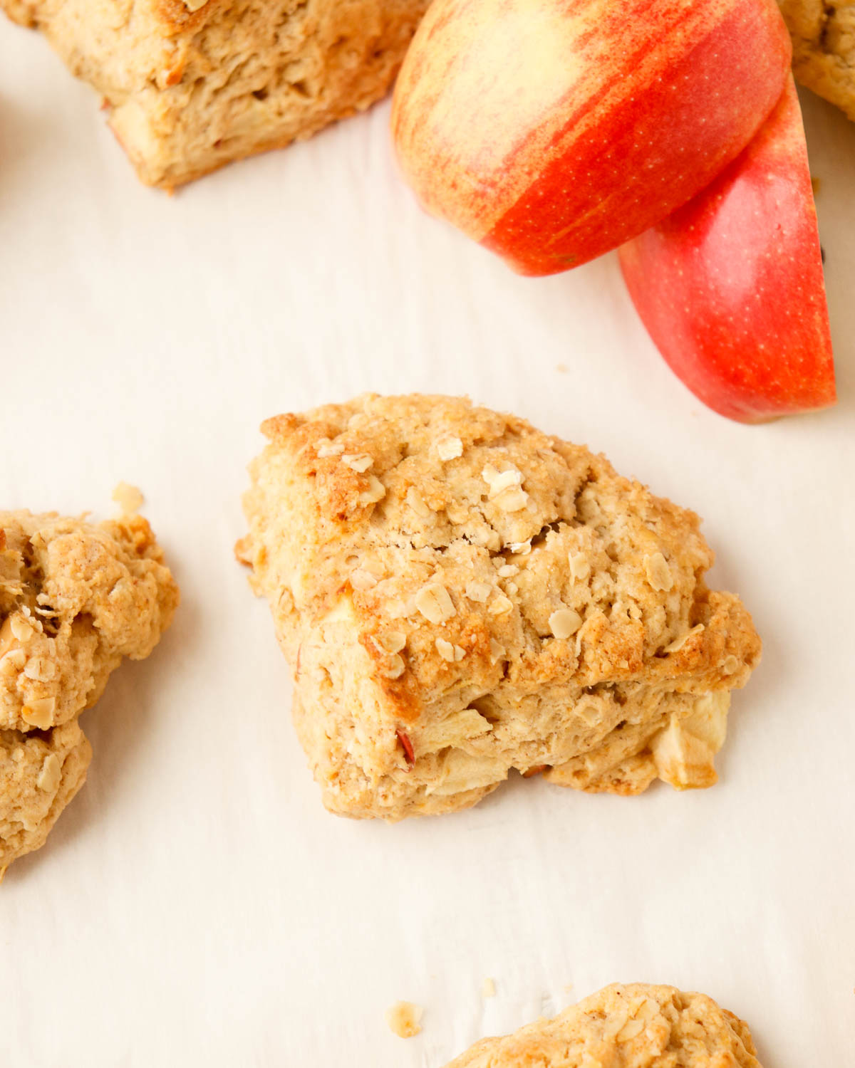 Apple oat scone with sliced red apples.