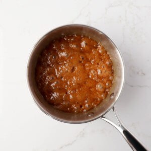 Cooked caramel sauce in a saucepan.