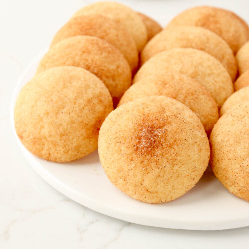 Snickerdoodle cookies on a white plate.