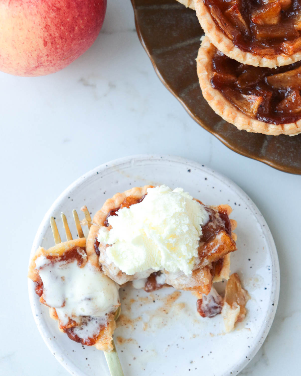 Apple pie tart with vanilla ice cream.