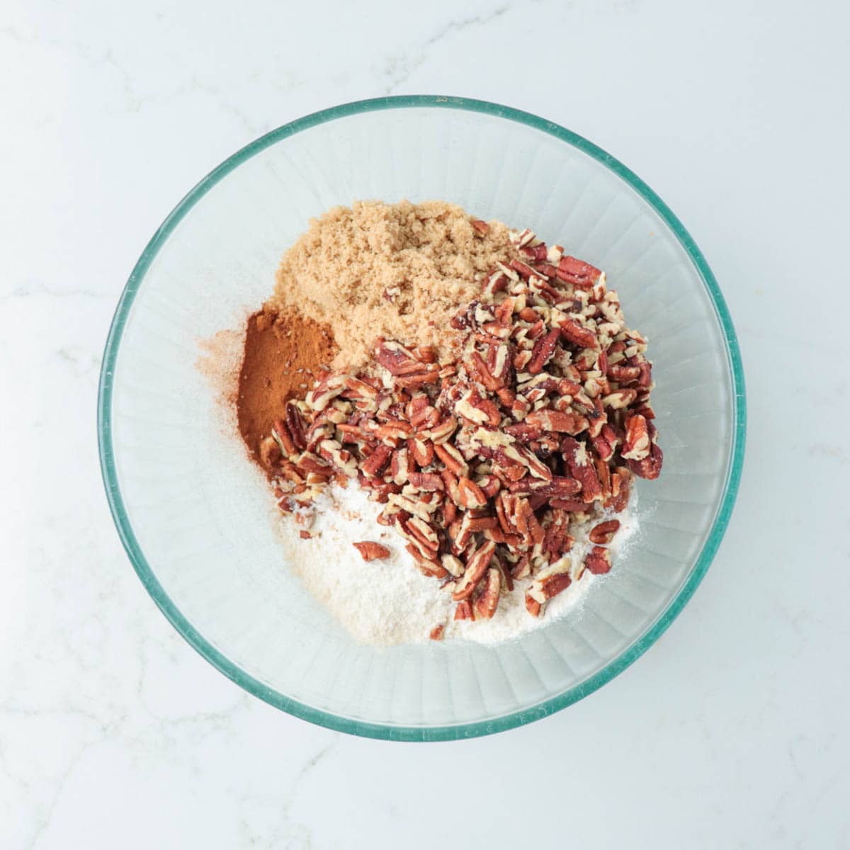 Crumble ingredients in a glass mixing bowl.