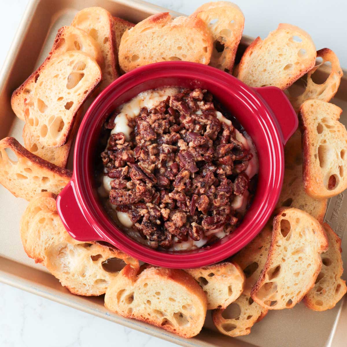 Baked brie served with toasted baguette.