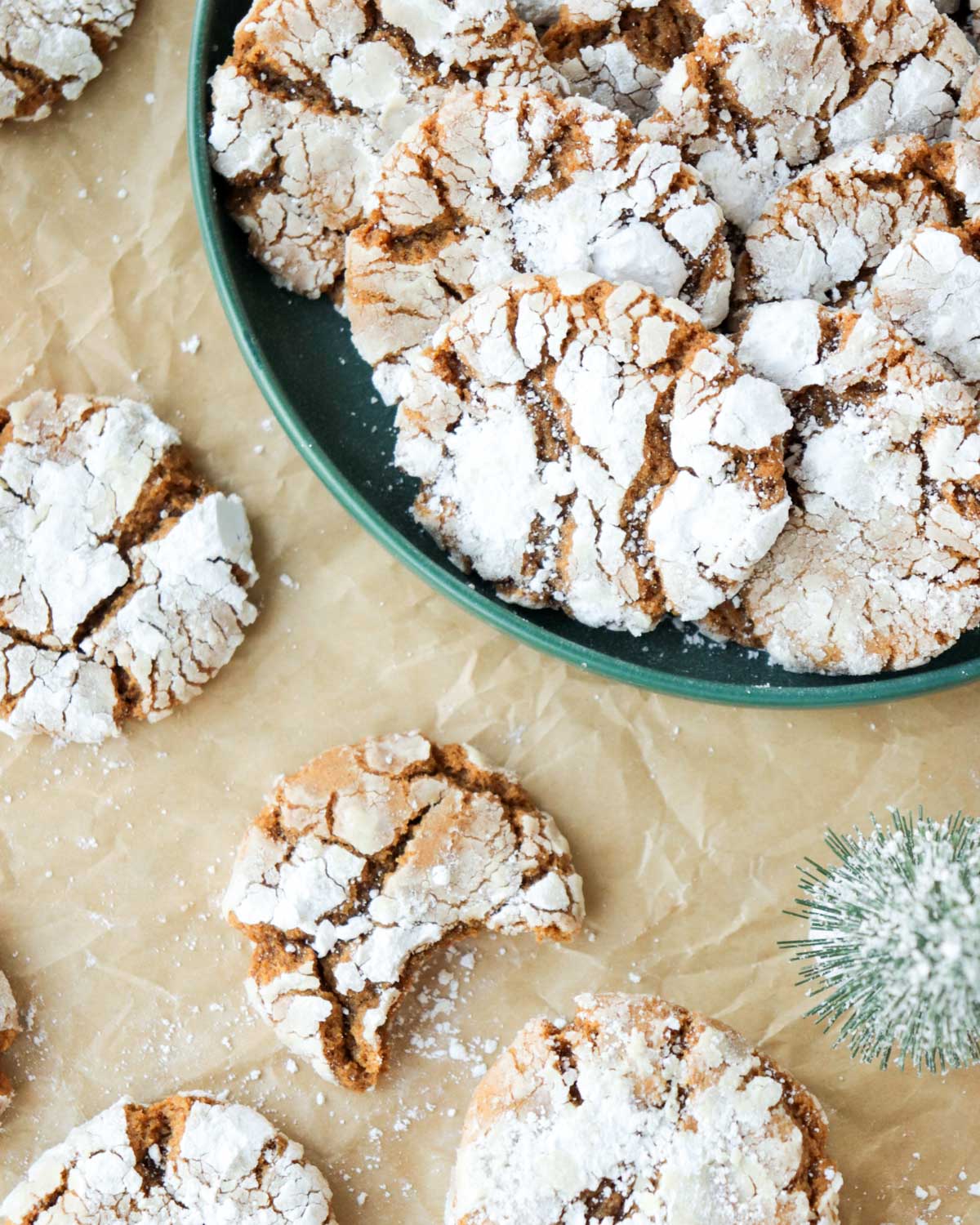 Cookies on a dark green plate.