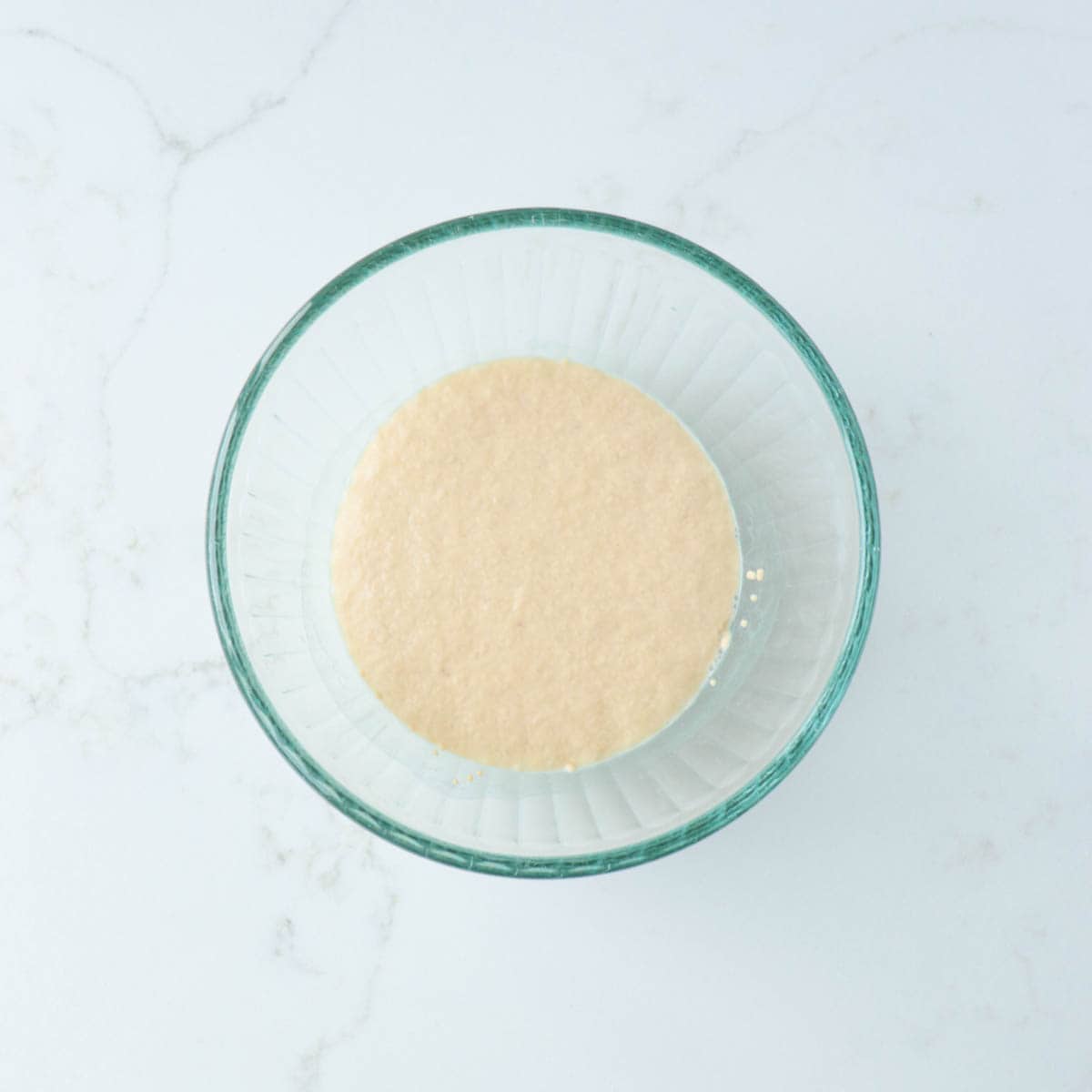 Yeast and water proofing in a glass bowl.