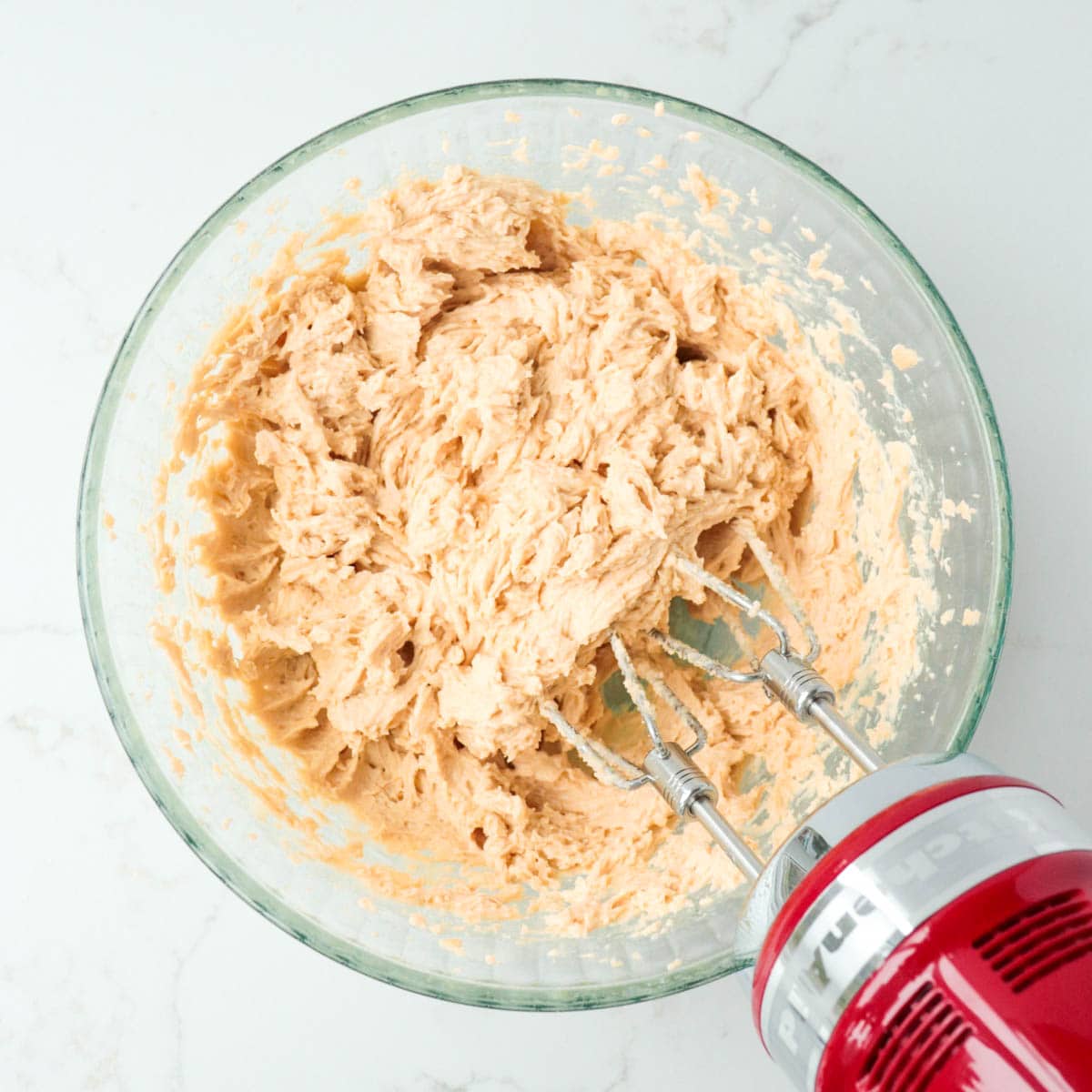 Creamed butter mixture in a bowl.