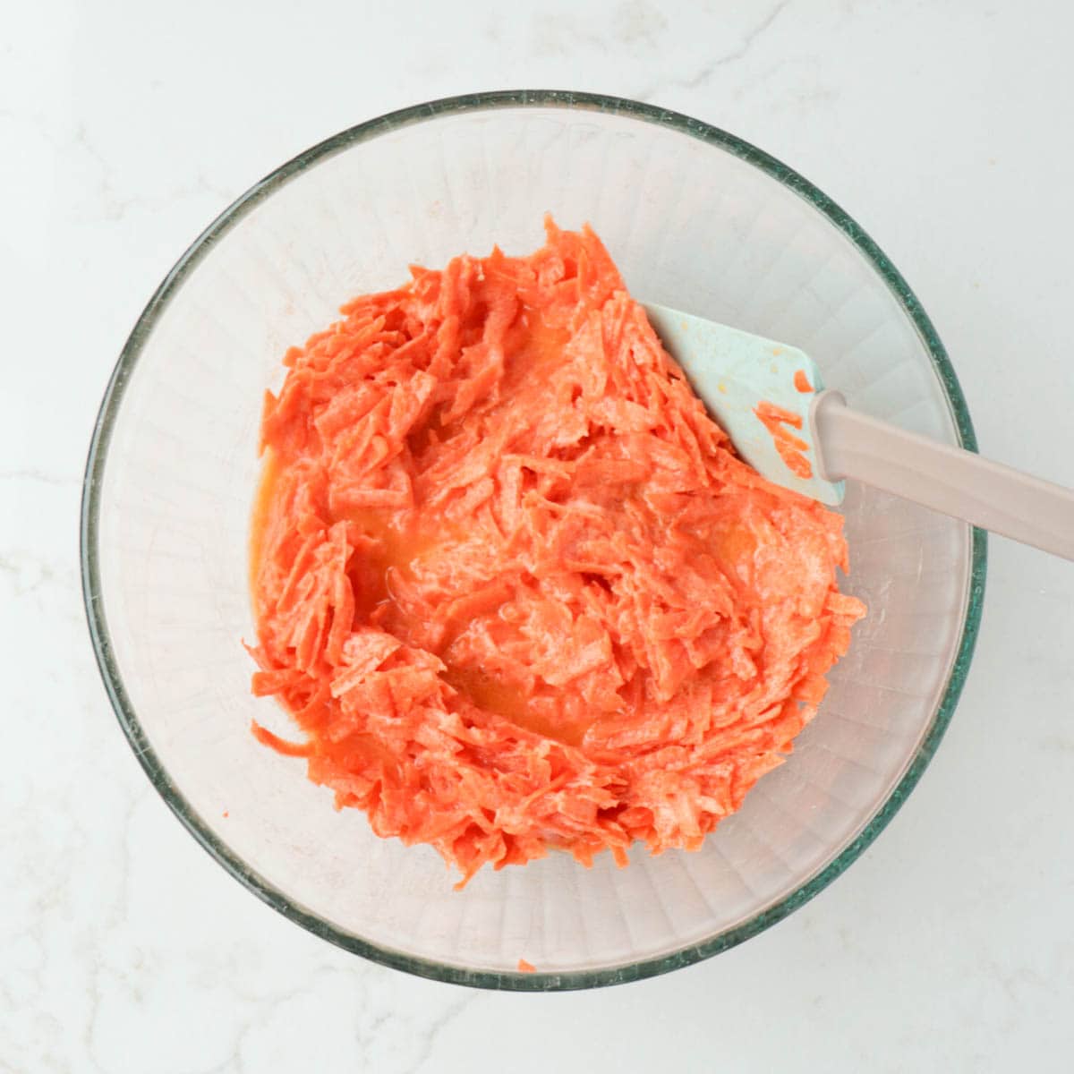 Wet ingredients combined in a glass bowl.