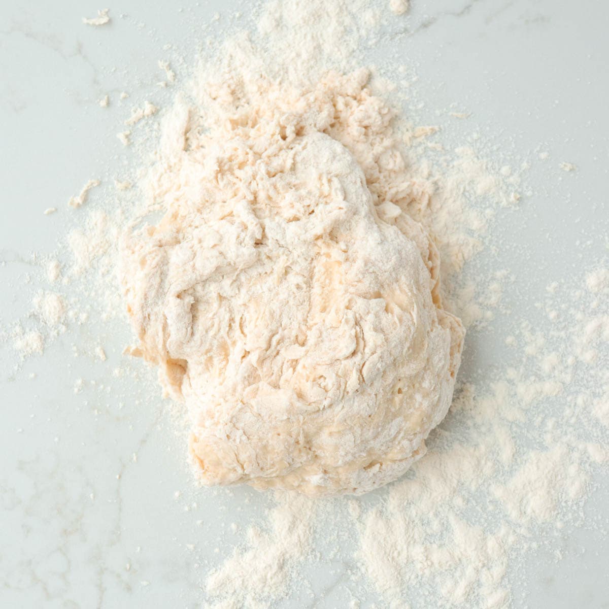 Dough on the countertop before kneading.