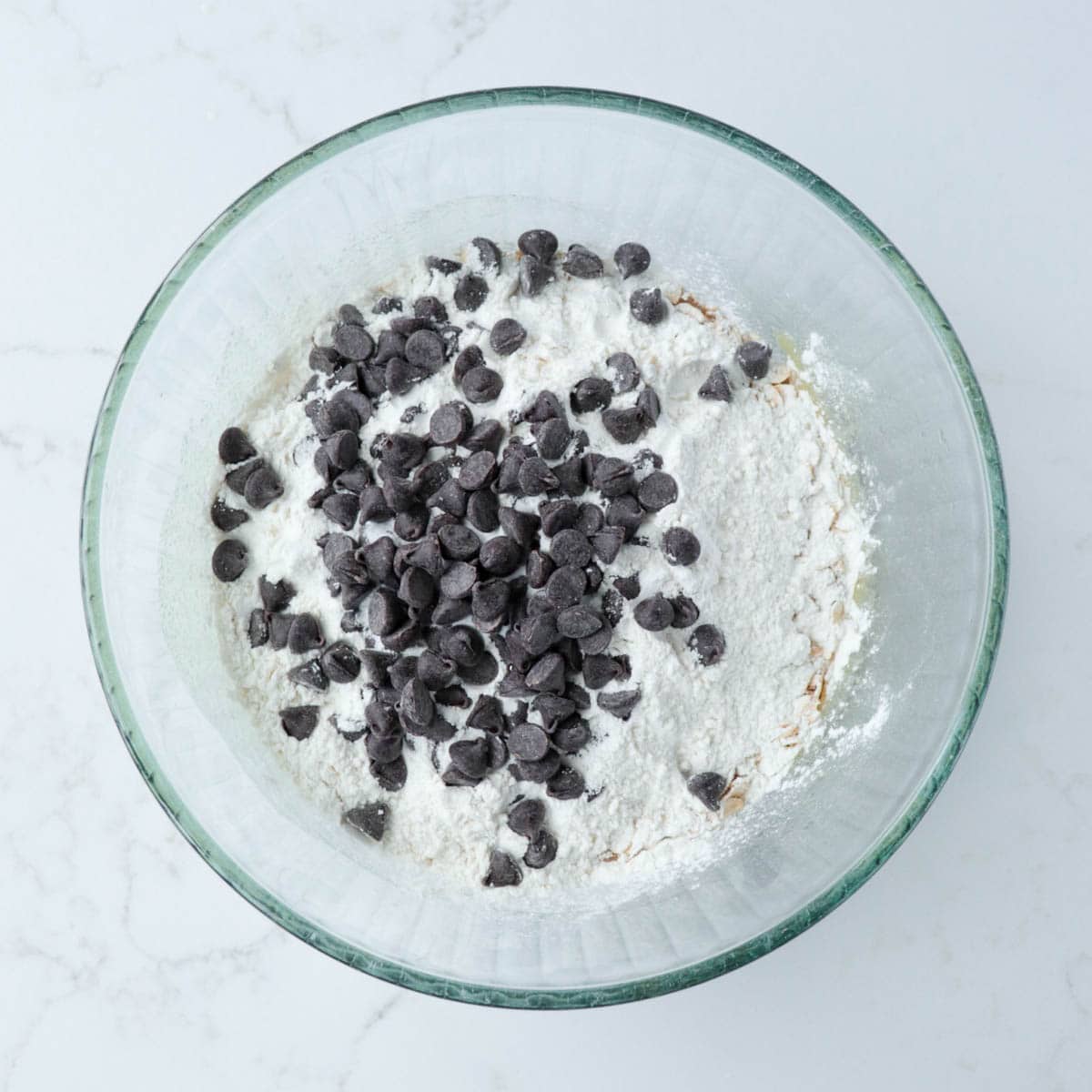 Dry ingredients and chocolate chips added to mixing bowl.