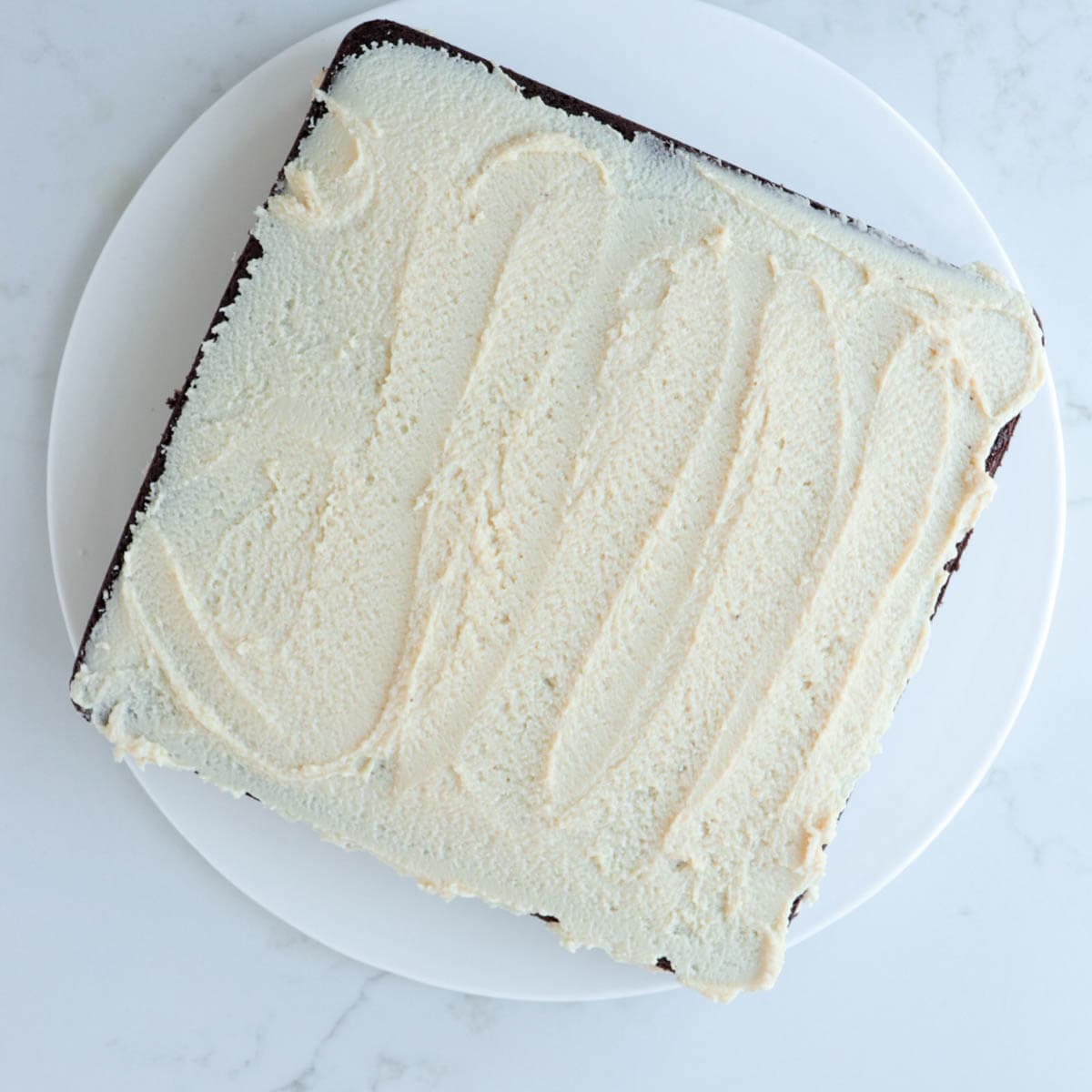Cake with tahini frosting on top.