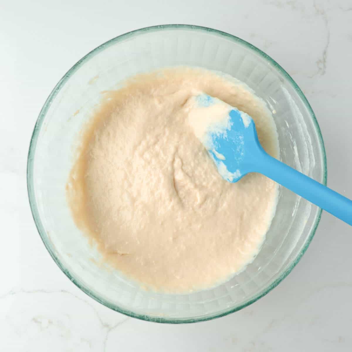 Flour added to bowl of wet ingredients.